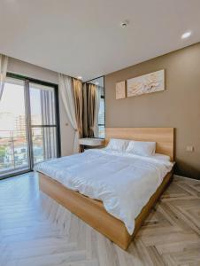 Ένα ή περισσότερα κρεβάτια σε δωμάτιο στο Real Homes