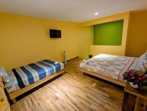 Postel nebo postele na pokoji v ubytování Casa Alixel Hotel Boutique + 2 fotografie