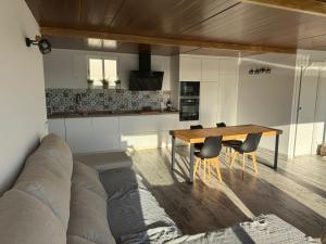 a living room with a couch and a table at Maravillas Loft in La Herradura