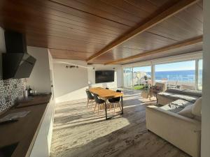 a living room with a table and a couch at Maravillas Loft in La Herradura