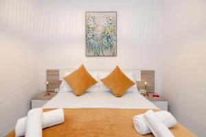 Ένα ή περισσότερα κρεβάτια σε δωμάτιο στο Apartamentos TrianaSol