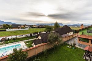 an aerial view of a house with a swimming pool at Vilman House in Râşnov