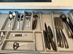 a tray filled with utensils in a sink at Gateway to Amsterdam in Almere