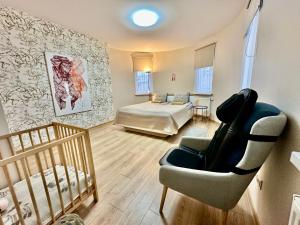 Postel nebo postele na pokoji v ubytování Japandi apartamentai