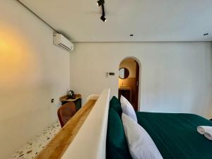 Postel nebo postele na pokoji v ubytování Ruma Mahavidna