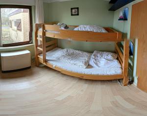 a bedroom with two bunk beds in a room at Ferienhaus Marienleuchte in Marienleuchte