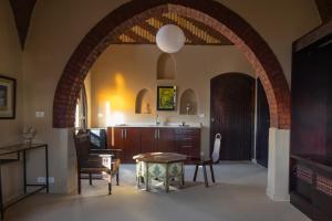an archway in a kitchen with a table and chairs at Laziza in Luxor +13 photos