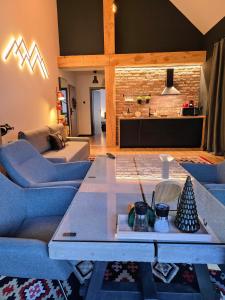 a living room with a couch and a table at Vila Ferdinand Apartments in Sinaia
