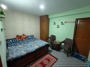 a bedroom with a dog laying on a bed at Pine View Kunal Home Inn Mashobra in Shimla +12 photos