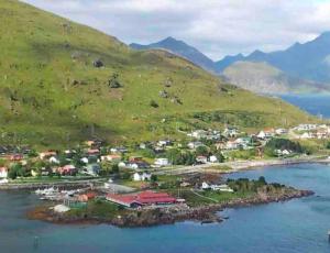 an aerial view of a small island in the water at Leilighet med balkong og havutsikt på Napp. in Napp