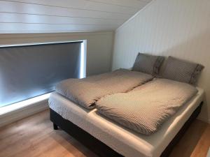Postel nebo postele na pokoji v ubytování Fisherman`s Cabin Lofoten