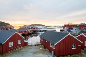 an aerial view of a village with red buildings at Authentic Cozy Rorbu in Stamsund