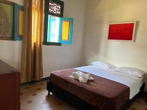 Letto o letti in una camera di FINCA HOTEL TRADICION CAFETERA