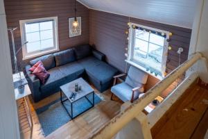 an overhead view of a living room with a blue couch at Authentic Lofoten Rorbu in Stamsund