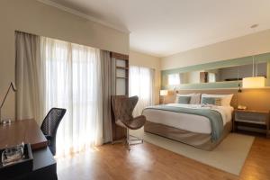 Letto o letti in una camera di Clarion Faria Lima