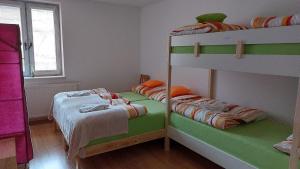 two bunk beds in a small room with at Hollandia Domasa - Nová Kelča, Prešovský kraj in Kelča