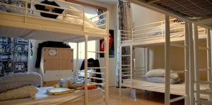 a room with two bunk beds in a room at Ruta 80 Hostel in Brno