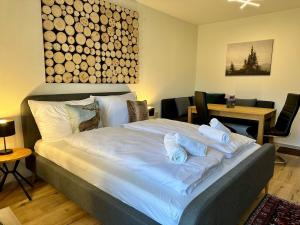 Postel nebo postele na pokoji v ubytování Mini Apartment mit Pool Nutzung & Balkon