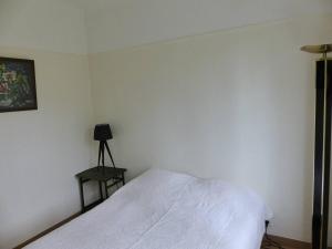 Łóżko lub łóżka w pokoju w obiekcie Villa LA TEIGNOUSE entre lac et océan terrasse et jardinet pour 6 personnes