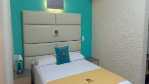 Postel nebo postele na pokoji v ubytování Hotel Yahalis