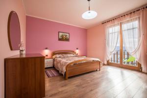 a bedroom with a bed and a large window at Casa Damiano in Tremosine Sul Garda