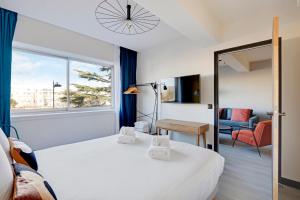 a hotel room with a bed and a window at North Paris Suite in Paris