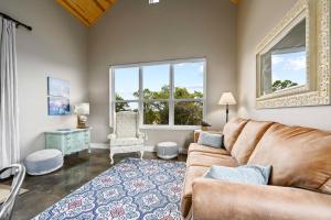 a living room with a couch and a chair at Hill Country Casitas in Dripping Springs