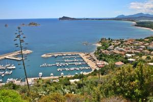 a view of a harbor with boats in the water at B&B Sa Clarera in Baunei +30 photos