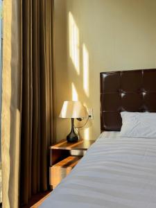 Postel nebo postele na pokoji v ubytování Q Garden Homestay