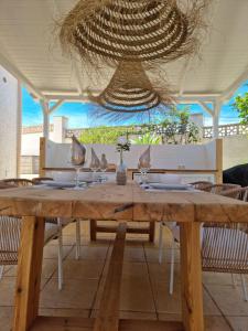 a wooden table with glasses on top of it at Casa Marie - Albir in Albir