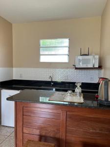 Kuchyň nebo kuchyňský kout v ubytování Casa Bouganville apto triplo