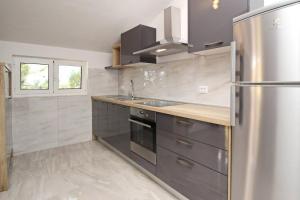 Kuchyň nebo kuchyňský kout v ubytování Sunshine Residence Baska 2