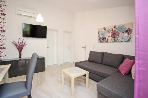 TV a/nebo společenská místnost v ubytování Sunshine Residence Baska 2