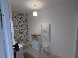a small room with a small table in a room at Studio Les Capucines in Bretteville-sur-Odon