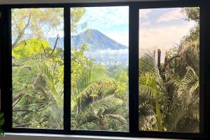 a window with a view of a mountain at La Bella Suite in San Salvador