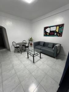 a living room with a couch and a table at Bianco 305 in Angeles