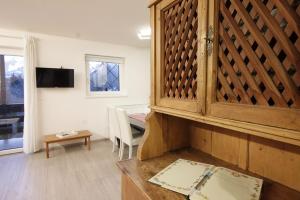 Televízia a/alebo spoločenská miestnosť v ubytovaní CASA 4 PIOPPI - Agenzia Dolomiti Affitti