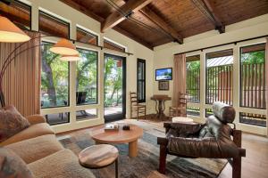 a living room with a couch and a table at The Leona in Lockhart