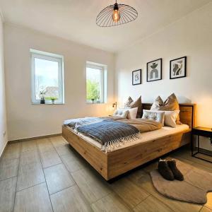 Postel nebo postele na pokoji v ubytování Ferienwohnung Lüttje Sünnschien Timmel