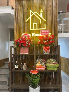 a store display with flowers and food on a shelf at Tom Homestay Cao Bang - Motorbike rental in Cao Bằng