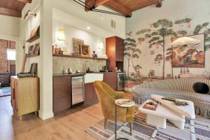 a kitchen and living room with a bed and a table at The Leona in Lockhart