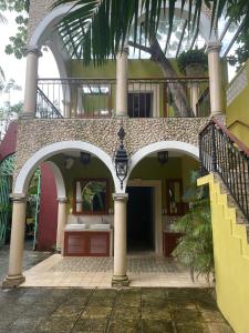 an entry to a house with a staircase and a building at Hostal Poquito a Poquito in Valladolid +58 photos
