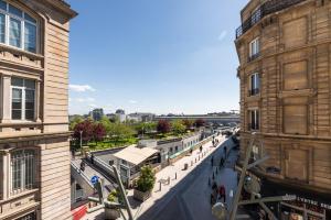 a view of a street between two buildings at Hotel Bristol Nord Paris in Paris