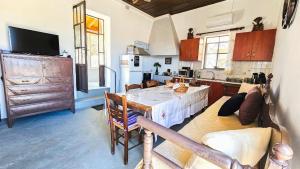 a kitchen with a large table in a room at Traditional House Aggeliki in Kounoupidhianá