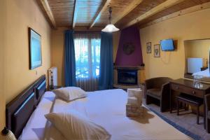Postel nebo postele na pokoji v ubytování Guesthouse Teloni