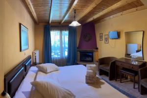 Postel nebo postele na pokoji v ubytování Guesthouse Teloni