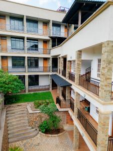 an aerial view of a building with a courtyard at Iwandaa Lodge And Apartments in Sokon +9 photos