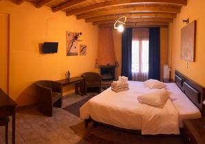 Postel nebo postele na pokoji v ubytování Guesthouse Teloni