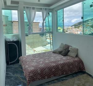 Ένα ή περισσότερα κρεβάτια σε δωμάτιο στο Casa Mirante Boa Vista no Centro arraial