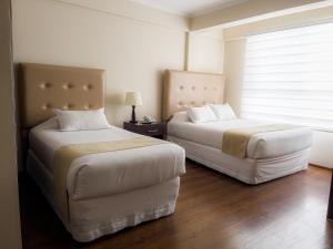 Postel nebo postele na pokoji v ubytování Domani Hotel Boutique